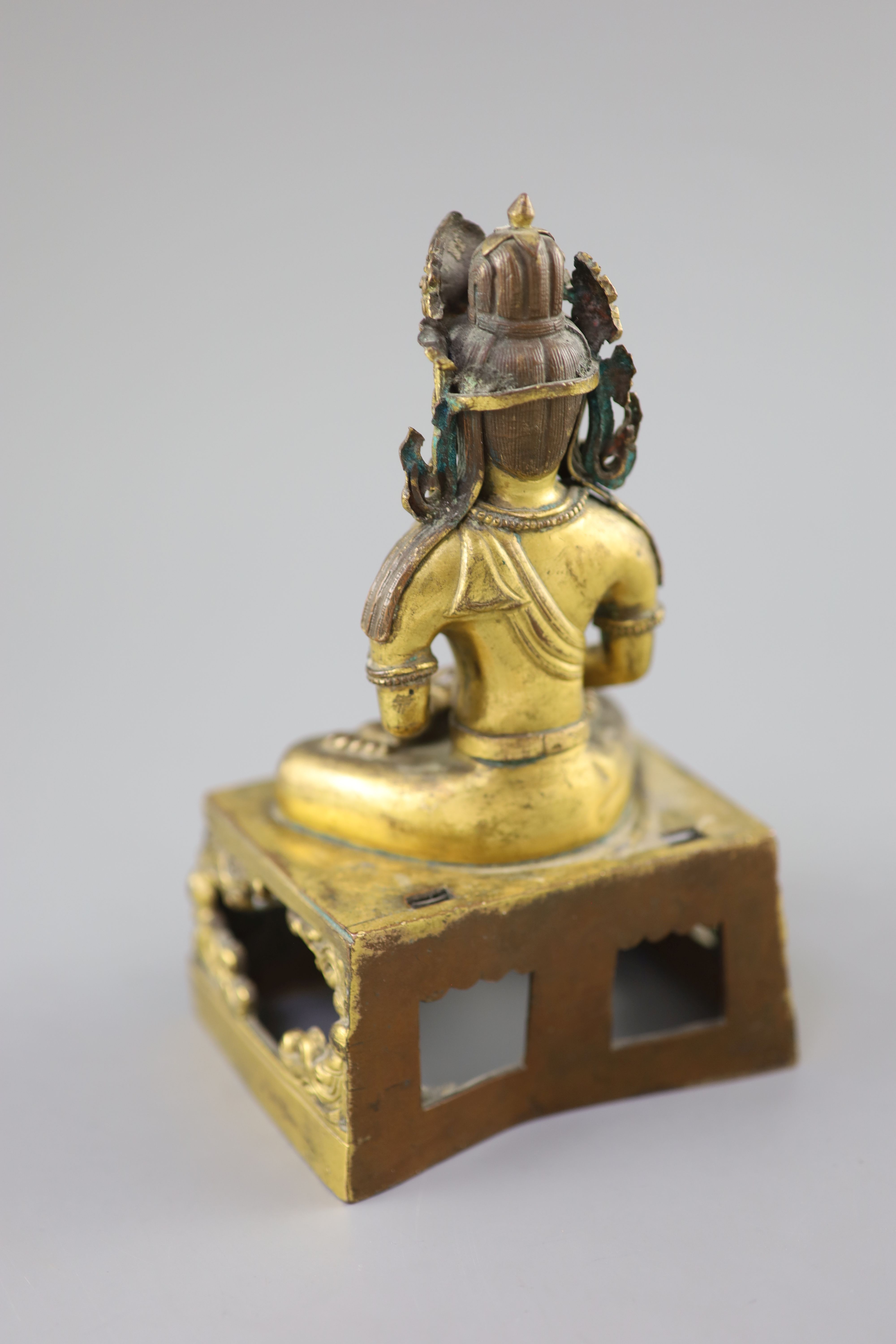 A Chinese gilt bronze seated figure of Amitayus, Qianlong period, dated 1770, Provenance - A. T. Arber-Cooke